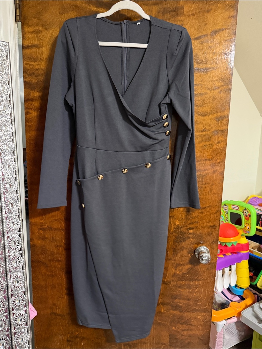 Classic Long-Sleeve Black Sheath Dress with Gold Button Detail